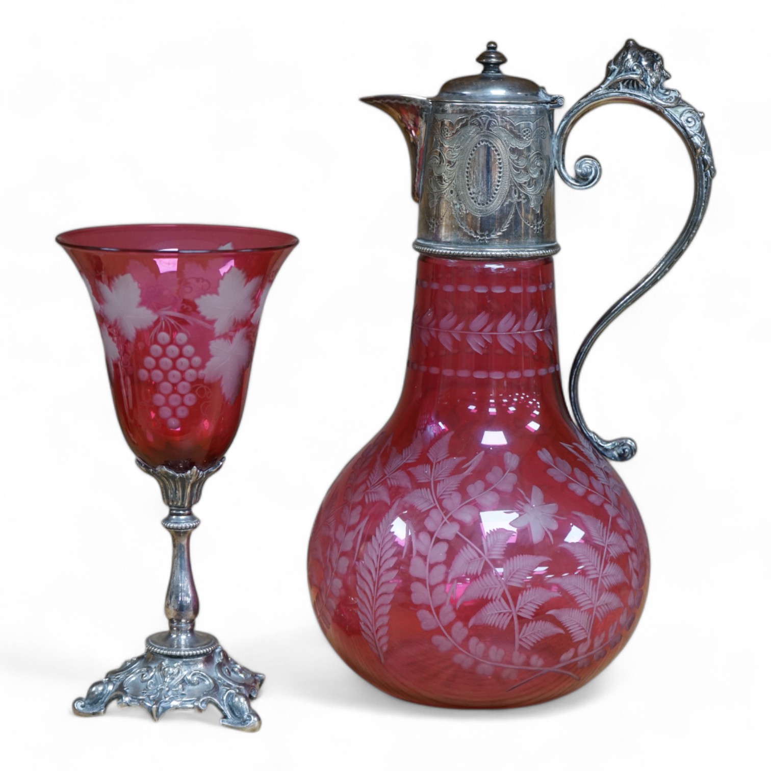 A Victorian electroplate mounted cranberry glass claret jug and a similar goblet by Elkington & Co. 26cm. Condition - good